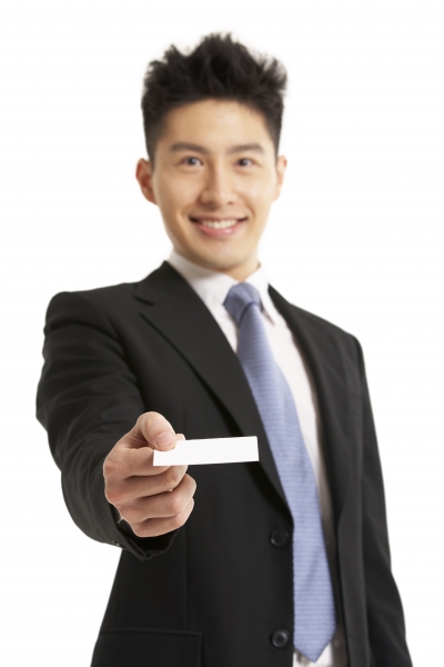 4653476-studio-portrait-of-chinese-businessman-offering-business-card